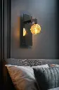 Applique bras miroir galet 05 Fuch situ SwitchOn.webp